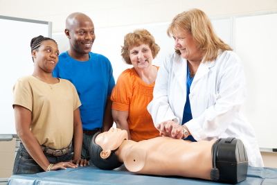 teaching first aid CPR using a state of the art doll.